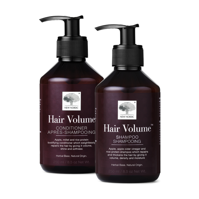 Bilde av to flasker med de urtebaserte Hair Volume Shampoo og Hair Volume Conditioner, som reparerer håret og gir det volum. NEW